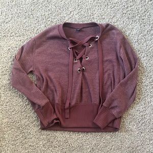 Long sleeve tie up sweater.